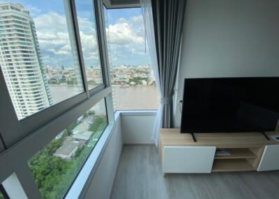 Modern living area with large windows and city view