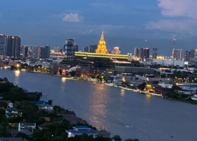 View of a city skyline with river in the foreground