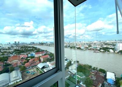 View from window overlooking the city skyline and river