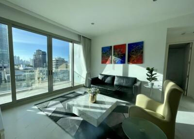 Bright living room with large windows and modern decor