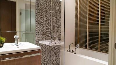 Modern bathroom with mosaic tile shower