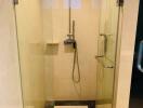 Modern bathroom with glass-enclosed shower