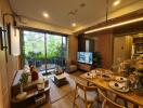 Cozy and modern living room with dining area and view of a balcony