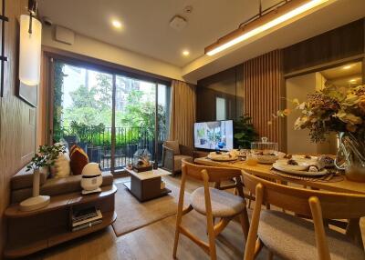 Modern and cozy living area with a dining space and large windows