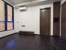 Modern living room with dark wooden floor and window shades