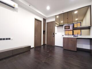 modern apartment living space with kitchenette