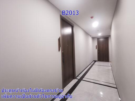 Bright hallway with numbered doors