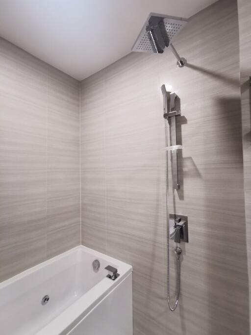 Modern bathroom with bathtub and rainfall showerhead