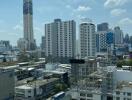 Cityscape view from high-rise building with blue sky