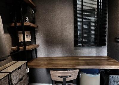 Modern study room with wooden desk and shelving