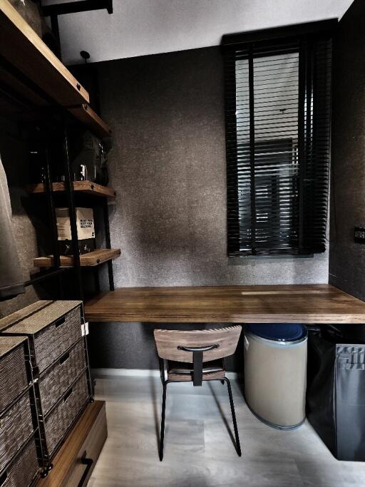 Modern study room with wooden desk and shelving