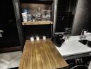 Compact kitchen with wooden counter and shelves