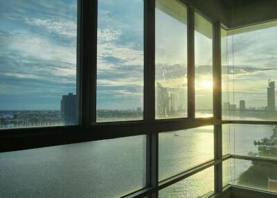 Living room with large windows and water view