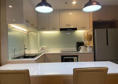 Modern kitchen with appliances and white countertop