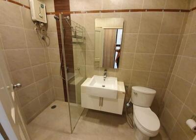 Modern bathroom with shower, toilet, and sink