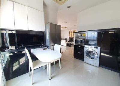 Modern kitchen with appliances and a dining area