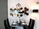 Modern dining area with stylish hexagonal mirror decor and contemporary lighting