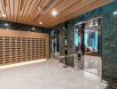 Modern building lobby with mailboxes and marble flooring