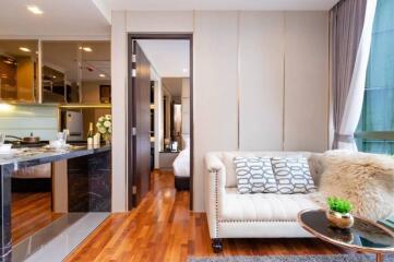 Modern living area with open kitchen and natural light