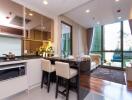 Modern open-plan living space featuring kitchen, dining, and sitting areas with large windows