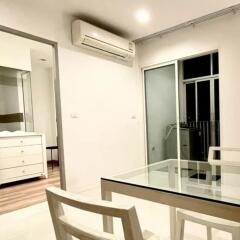 cozy dining area with a glass-top table