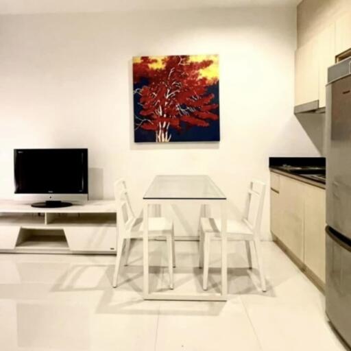 Modern kitchen with a small dining area