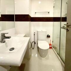 Modern bathroom with glass shower and sleek fixtures