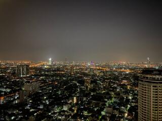 Night view of city from high-rise apartment balcony