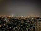 Night view of city from high-rise apartment balcony