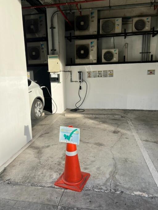 Designated parking spot with electric car charging station