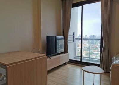 Living room with city view, large window and modern furniture