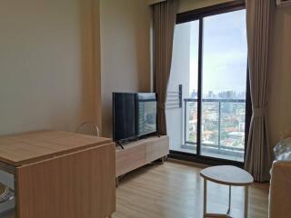 Living room with city view, large window and modern furniture