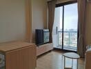 Living room with city view, large window and modern furniture