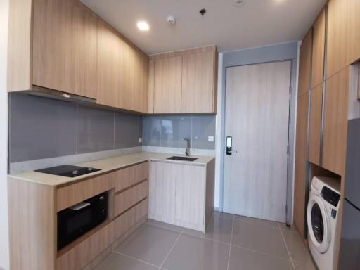 Modern kitchen with wooden cabinets and built-in appliances