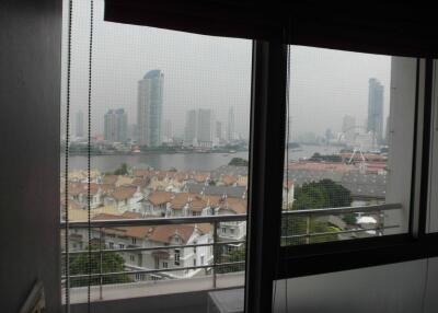 View from window showing cityscape and river