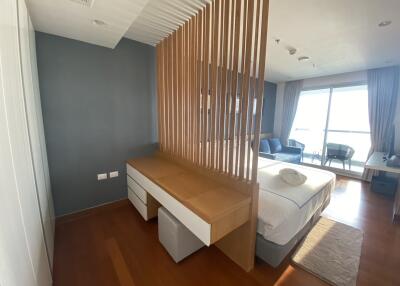 Modern bedroom with partition and desk