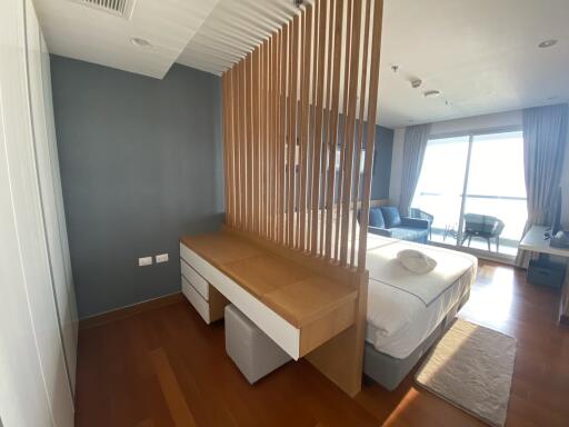 Modern bedroom with partition and desk