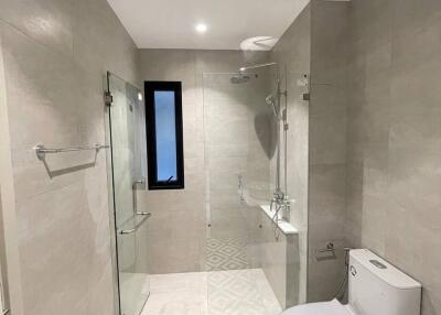 Modern bathroom with shower and black and white patterned floor