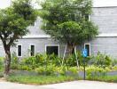 Front view of a building with natural landscaping