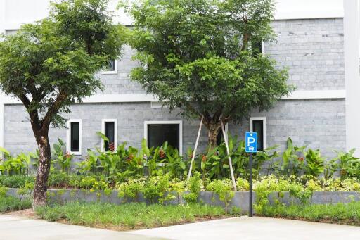 Front view of a building with natural landscaping