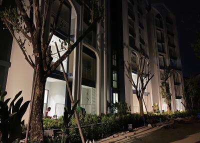 Exterior view of a multi-story residential building at night