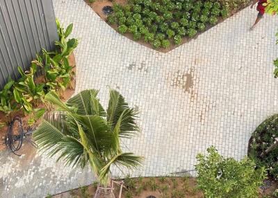 An aerial view of a building area with a pool