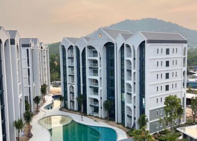 Aerial view of modern apartment buildings with a swimming pool