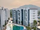 Aerial view of modern apartment buildings with a swimming pool