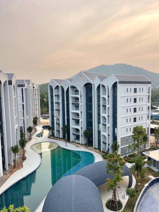 Aerial view of modern apartment buildings with a swimming pool