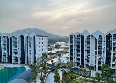 Modern apartment complex with pool and landscaping