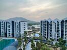 Modern apartment complex with pool and landscaping