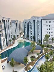 Aerial view of residential buildings with swimming pool and landscaping