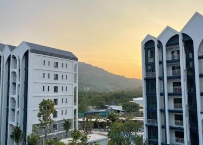 View of residential buildings with sunset in the background