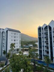 View of residential buildings with sunset in the background